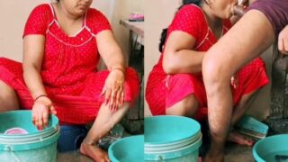 Red dress aunty enjoys his son cock while sucking in the bathroom